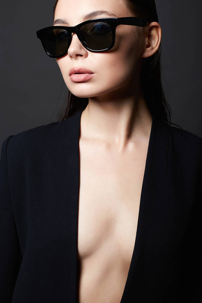 fashion portrait of Beautiful sexy woman in sunglasses. beauty girl in suit - Photo, Image