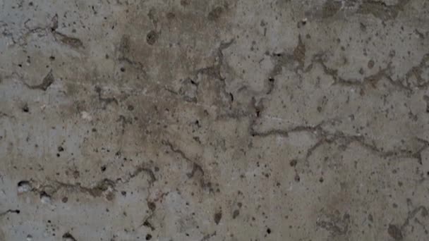 texturizado fundo de concreto cinza velho manchado com estuque bege com arranhões e buracos. - Filmagem, Vídeo