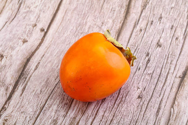 Ripe sweet and tasty persimmon fruit - Photo, Image