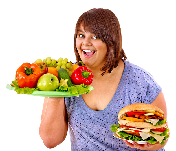 kadın meyve ve hamburger arasında seçim yapma. - Fotoğraf, Görsel