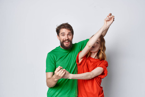 married couple hug friendship colorful t-shirts family isolated background - Photo, Image