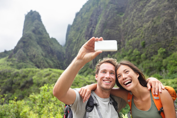 Couple taking selfie during hiking on Hawaii - Photo, Image