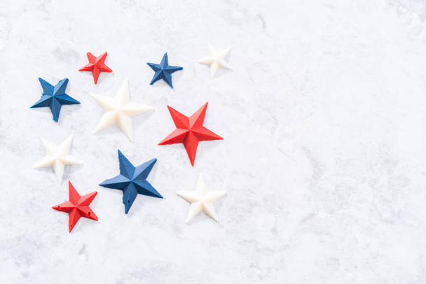 Homemade color chocolate stars that are made from color chocolate molds. - Photo, image
