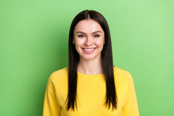 Photo portrait of pretty brunette smiling in yellow outfit isolated on bright green color background - Valokuva, kuva