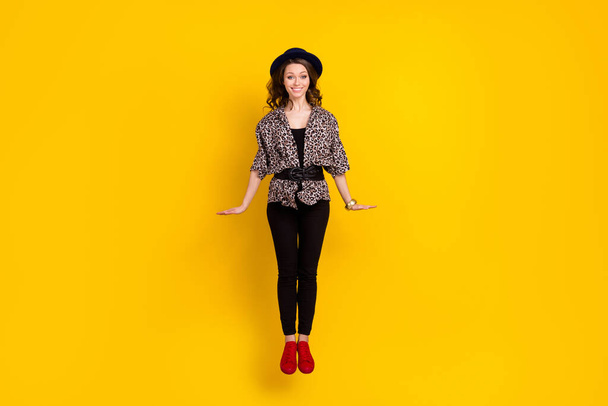 Full length photo of happy nice pretty young woman jump up smile isolated on yellow color background - Valokuva, kuva