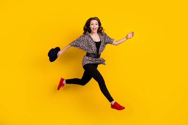 Full body profile side photo of amazed happy young woman jump run empty space isolated on yellow color background - Valokuva, kuva