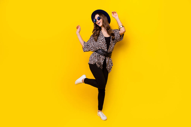 Full body photo of attractive young happy lady dance good mood wear glamour clothes isolated on yellow color background - Фото, изображение