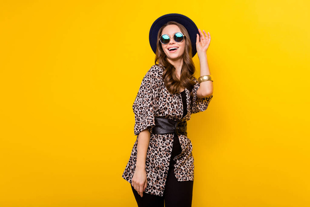 Photo of glamour happy charming lady look empty space wear sunglass isolated on yellow color background - Fotoğraf, Görsel