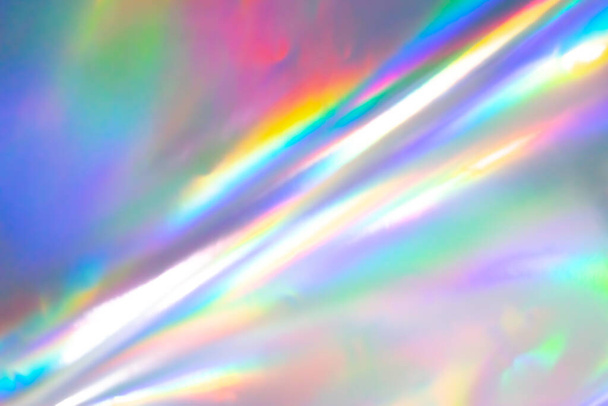 Colorful holographic background. Modern Rainbow foil for Texture, cover, wallpaper, print, etc. Bright futuristic blurred hologram and Abstract gradient colors.  - Photo, Image