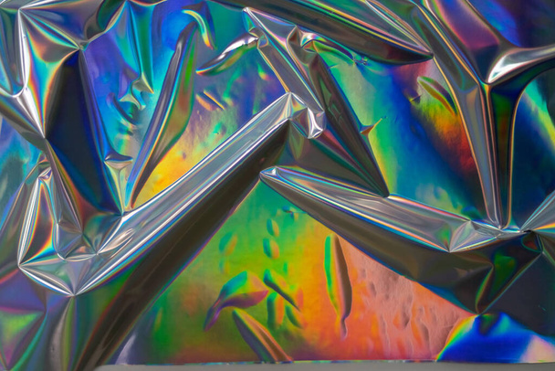 Barevné holografické pozadí. Moderní Rainbow fólie pro texturu, obal, tapety, tisk, dll. Tmavý futuristický rozmazaný hologram a Abstraktní barvy gradientu.  - Fotografie, Obrázek