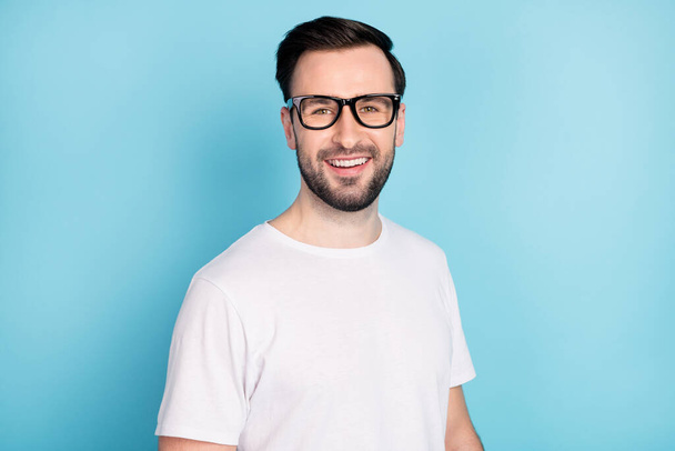 Photo of satisfied person toothy smile look camera wear spectacles isolated on blue color background. - Фото, зображення