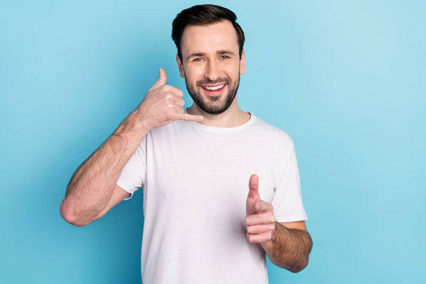 Photo of charming happy young man point finger you gesture call me isolated on pastel blue color background. - Φωτογραφία, εικόνα