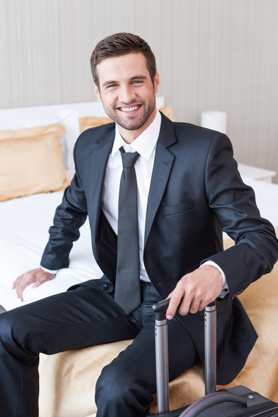 Businessman in formalwear carrying suitcase - Photo, image