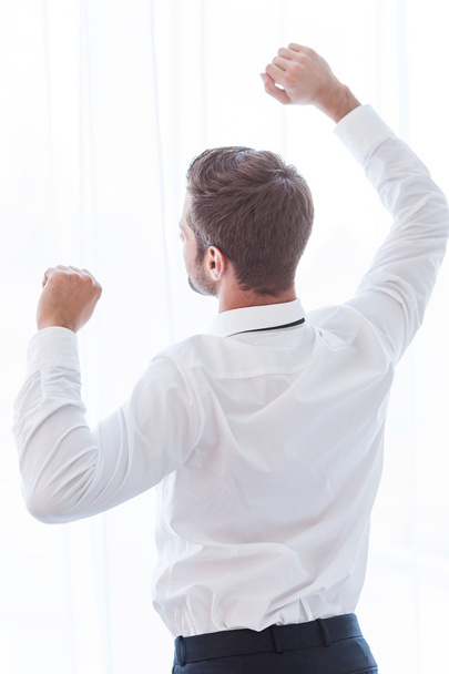 Man in shirt and tie raising his arms - Foto, imagen