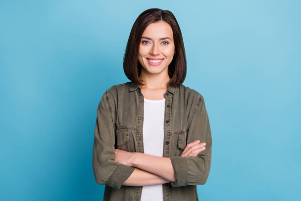 Photo of charming cool lady arms crossed ready for start-up work wear grey clothes isolated over blue color background - Foto, Imagen