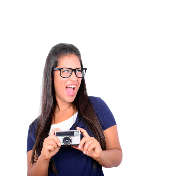 Young beautiful smiling woman holding retro vintage camera again - 写真・画像