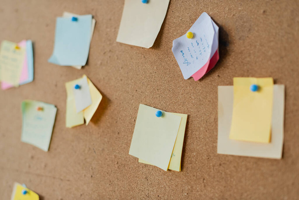 Colorful sticky notes on board in office  - Photo, Image