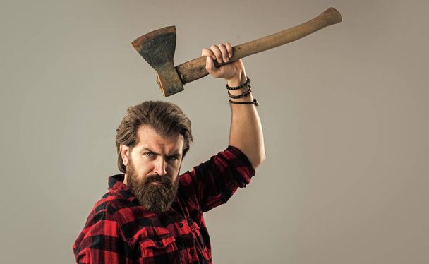 very serious. masculinity. barbershop and hairdresser. brutal guy with long beard. brutal mature hipster wear checkered shirt. casual and denim trends. handsome man. male charisma and brutality - Photo, image