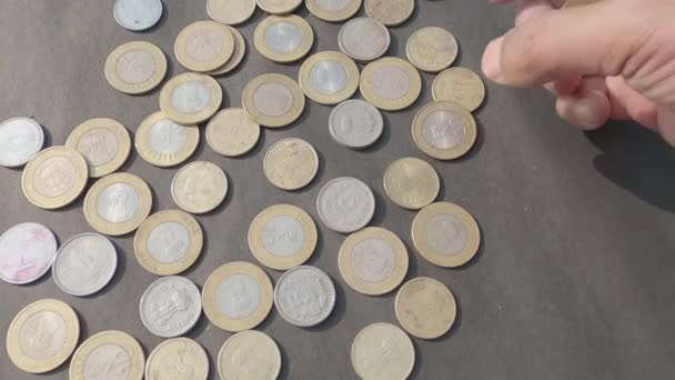 Man Hand picking up Indian Rupee Coins. high Angle view. Close up. Business Finance Activity Background. - Footage, Video
