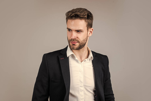 young handsome man in formal wear has bristle on face, agile business - Foto, Bild