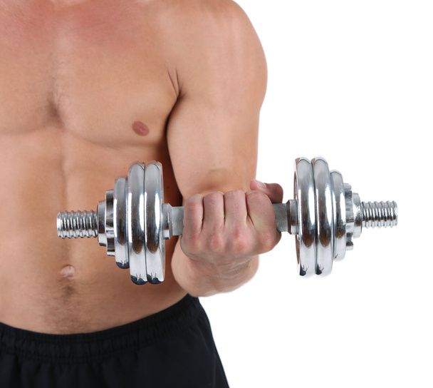 Young muscular sportsman execute exercise with dumbbell isolated on white - Φωτογραφία, εικόνα