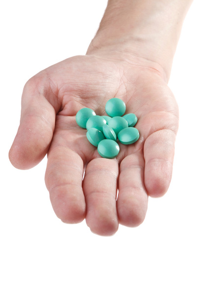 Medical pills in hand close-up on white - Foto, Imagem