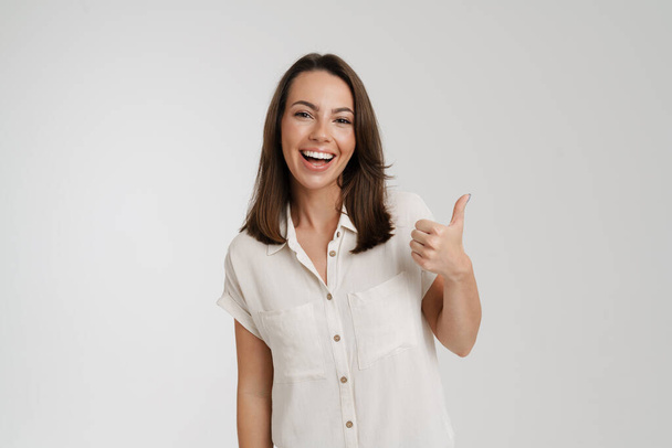 Young european woman smiling and showing thumb up isolated over white background - Foto, Imagem