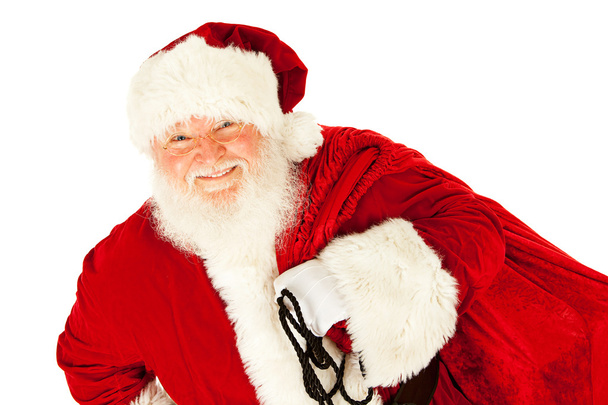 Santa: Santa Claus Carrying Sack of Presents - Foto, immagini