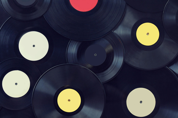 Vinyl disks wall, vintage musical background - Фото, изображение