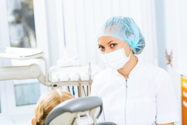 Dentist inspecting patient - Φωτογραφία, εικόνα