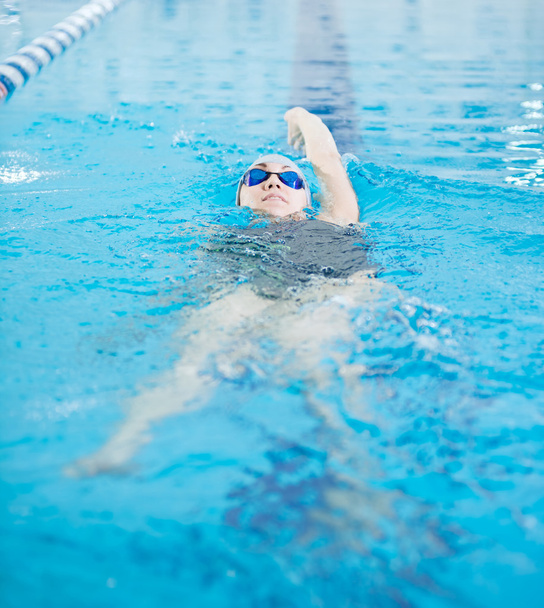 Girl in swimming back crawl stroke style - Photo, Image