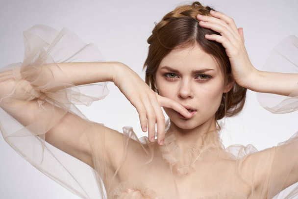 beautiful woman gesture hands cosmetics fashion hairstyle posing model studio - Foto, afbeelding