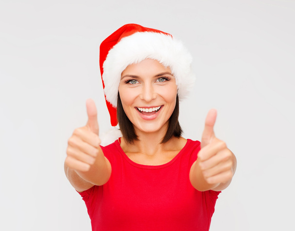 woman in santa helper hat showing thumbs up - Foto, Imagem