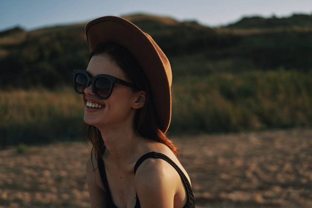 woman in sunglasses near car travel summer vacation landscape - Фото, зображення