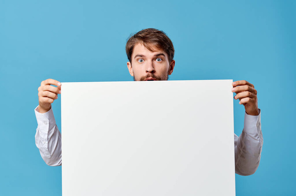 emotional man White mockup poster in hand advertising isolated background - Φωτογραφία, εικόνα