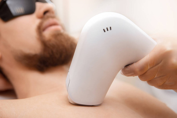 Closeup man torso hair removal laser epilation studio - Photo, Image