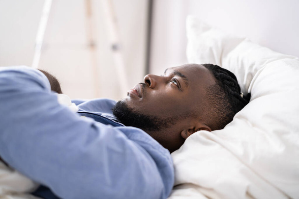 Young Man Suffering From Insomnia Lying In His Bed - Fotó, kép