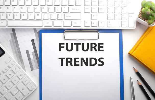 FUTURE TRENDS written on paper with keyboard, chart, calculator and notebook - Photo, Image