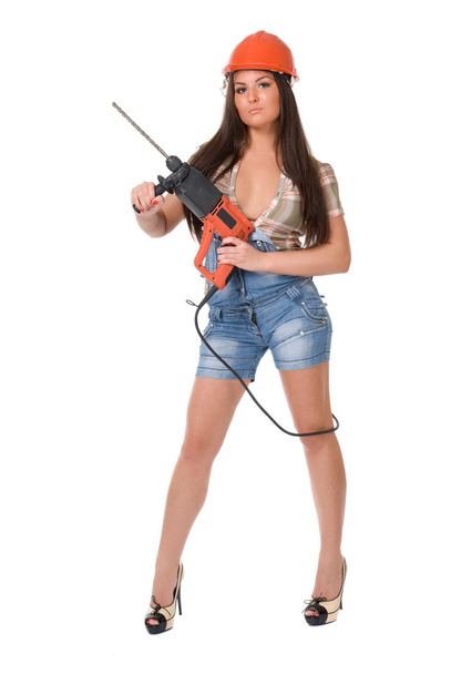 Woman with electric hammer drill. - Foto, afbeelding