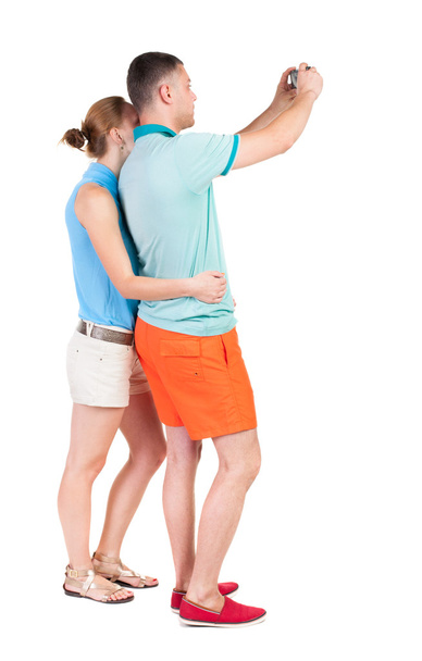 Back view of couple photographing.  - Photo, Image