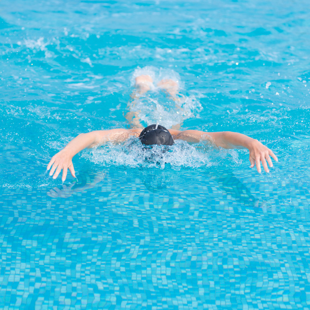 Girl swimming butterfly stroke style - Photo, Image