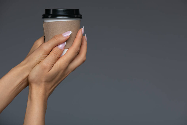 Take Away White Paper Hot Coffee Cup With Right Hand Holding In Studio. - Photo, Image
