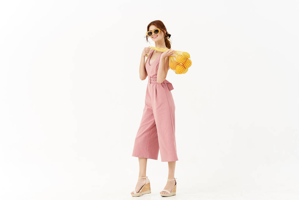 woman in pink dress glamor posing model isolated background - Valokuva, kuva