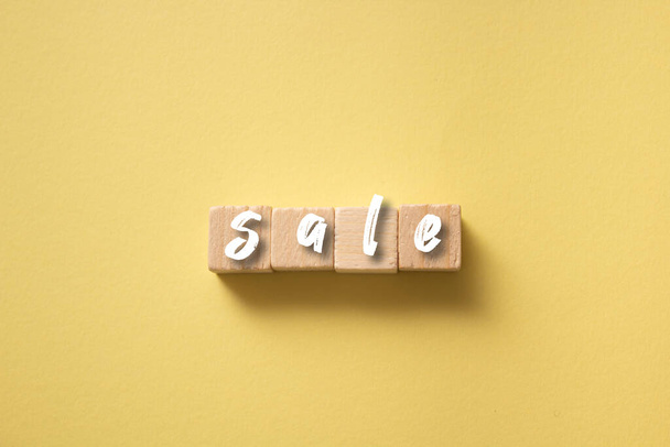 A closeup of the wooden blocks with the word sale. - Foto, afbeelding