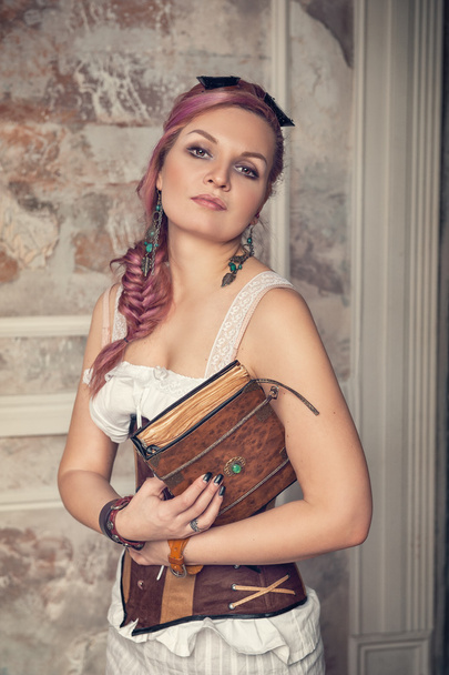 Beautiful steampunk woman with old book - Photo, Image