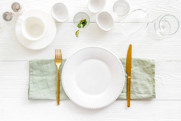 Dinnerware set with view from above - plate with cutlery and napkin - Photo, Image
