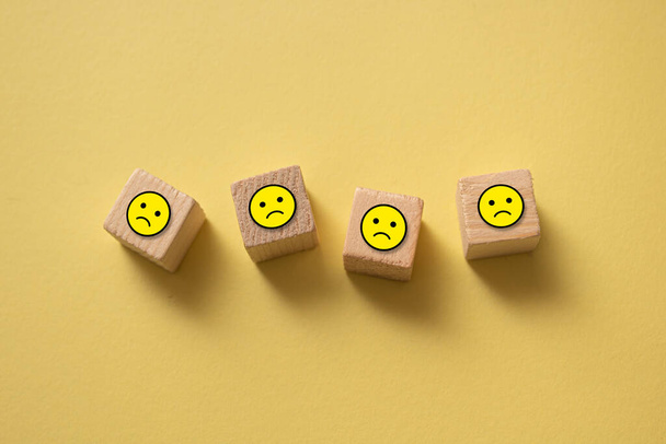 A closeup of the wooden blocks with emoji. - Zdjęcie, obraz