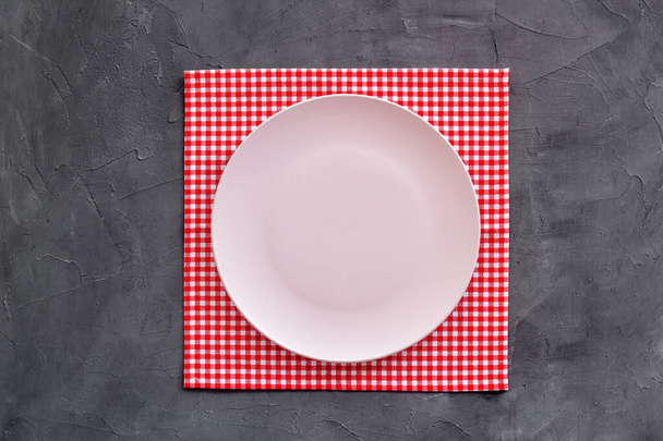 Table setting for dinner. Empty plate on napkin - dishware top view - Фото, зображення