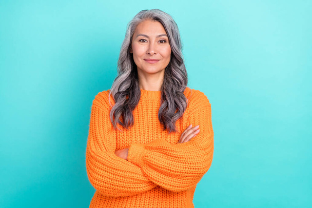 Portrait of attractive content cheerful grey-haired woman folded arms isolated over vibrant teal turquoise color background - Фото, зображення