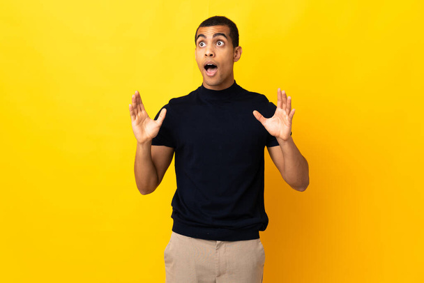 African American man over isolated background with surprise facial expression - Foto, Imagen